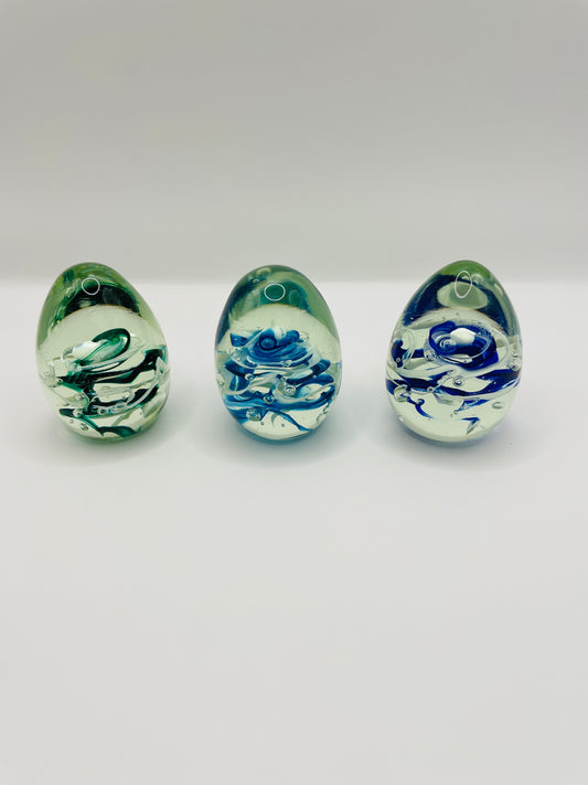 Glass egg paperweight